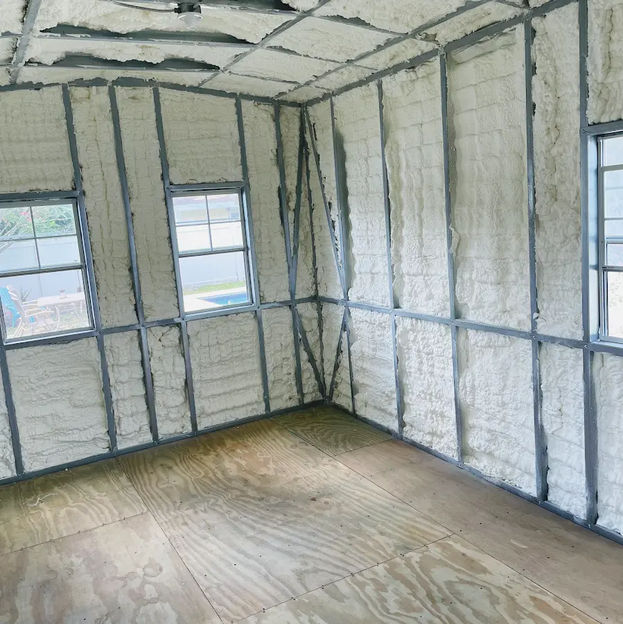 Closed-cell spray foam insulation applied to wall cavities in a residential project in Huron
